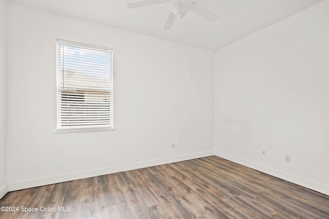 spare room featuring hardwood / wood-style floors and ceiling fan