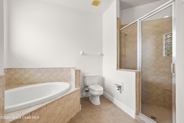 bathroom featuring tile patterned floors, toilet, and plus walk in shower