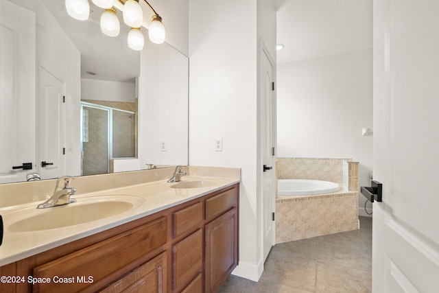 bathroom featuring tile patterned floors, vanity, and plus walk in shower