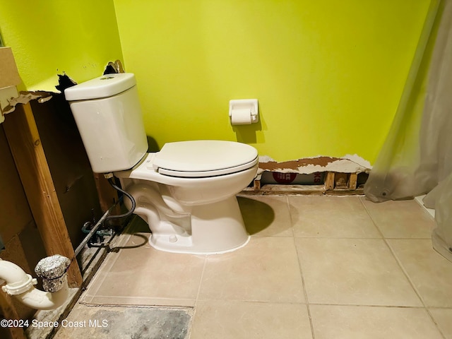 bathroom with tile patterned flooring and toilet