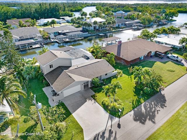 birds eye view of property with a water view