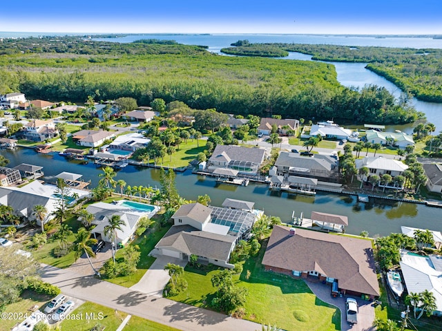 379 Hiawatha Way, Melbourne Beach, FL 32951 - aerial perspective of suburban area featuring a nearby body of water and a forest