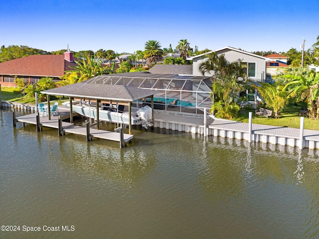 379 Hiawatha Way, Melbourne Beach, FL 32951 - dock featuring a water view, a lanai, boat lift, and a residential view