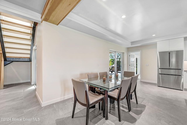 dining space with light colored carpet