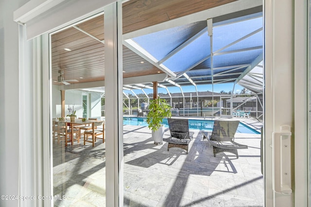 379 Hiawatha Way, Melbourne Beach, FL 32951 - sunroom featuring a pool and ceiling fan