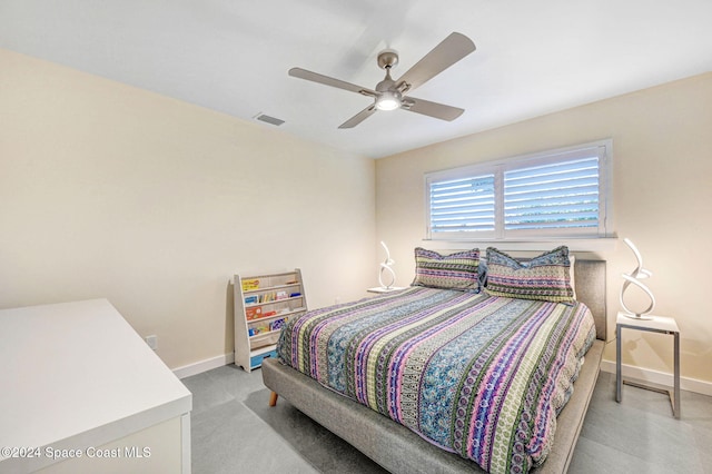 bedroom with ceiling fan and light carpet