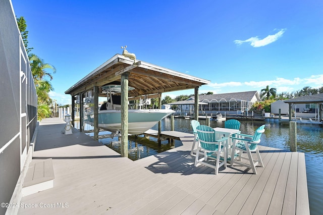 379 Hiawatha Way, Melbourne Beach, FL 32951 - dock featuring boat lift and a water view