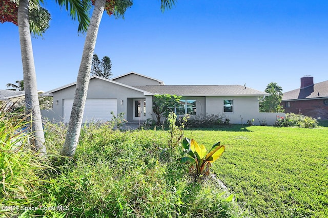 ranch-style house with a front yard and a garage