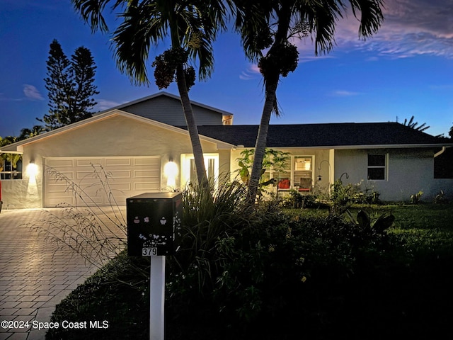 view of front of property with a garage