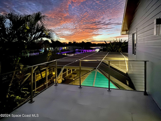 view of balcony at dusk