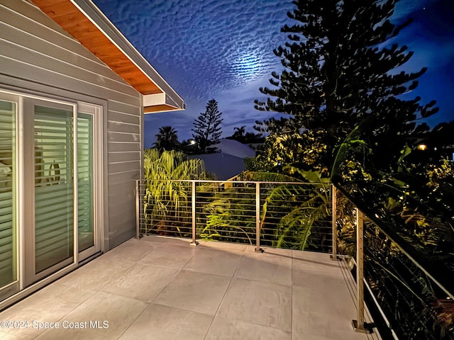379 Hiawatha Way, Melbourne Beach, FL 32951 - patio at night with a balcony