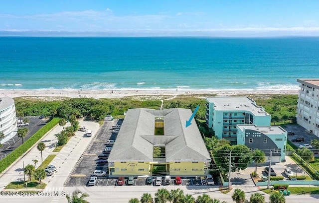 aerial view with a water view and a view of the beach