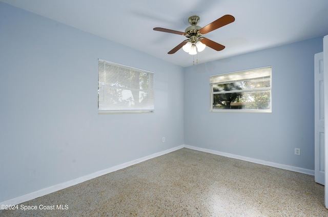 spare room featuring ceiling fan