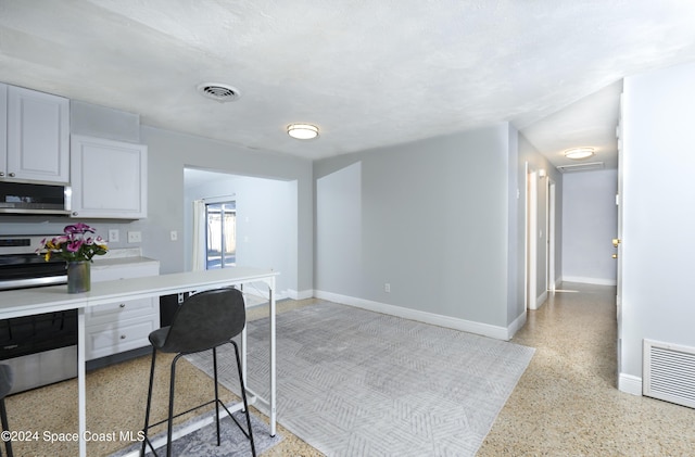 kitchen featuring white cabinetry and stainless steel appliances