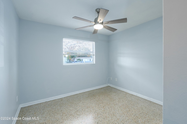 unfurnished room with ceiling fan