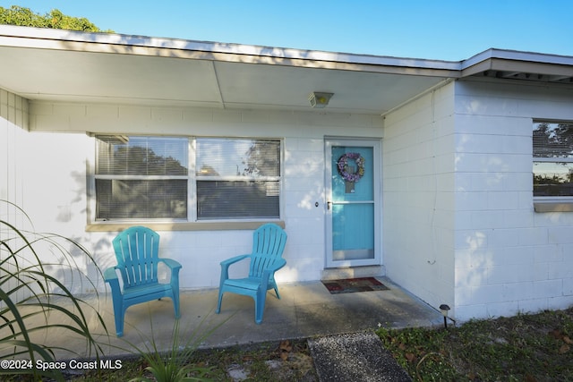 property entrance with a patio area