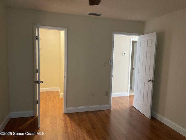 unfurnished bedroom featuring hardwood / wood-style flooring