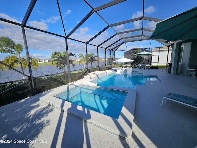 view of swimming pool featuring an in ground hot tub, a patio area, and a lanai