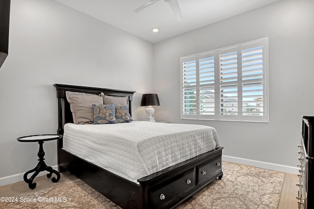 bedroom featuring light wood-type flooring and ceiling fan