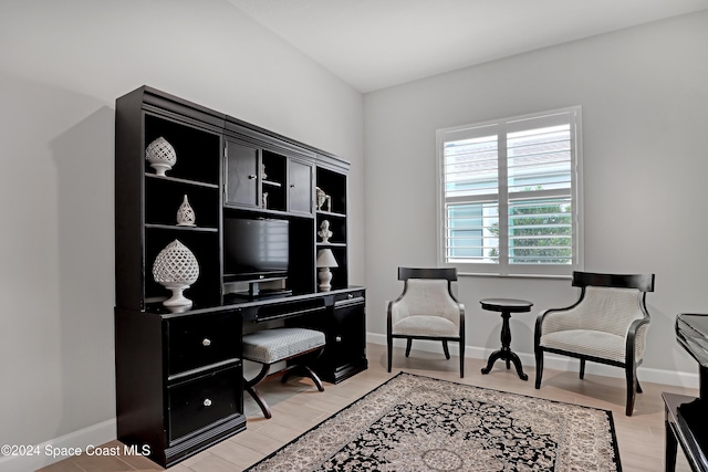 office area with light hardwood / wood-style floors