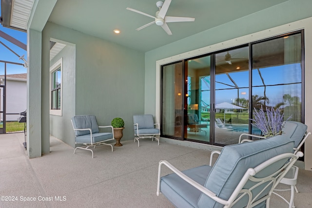 view of patio / terrace with glass enclosure and ceiling fan