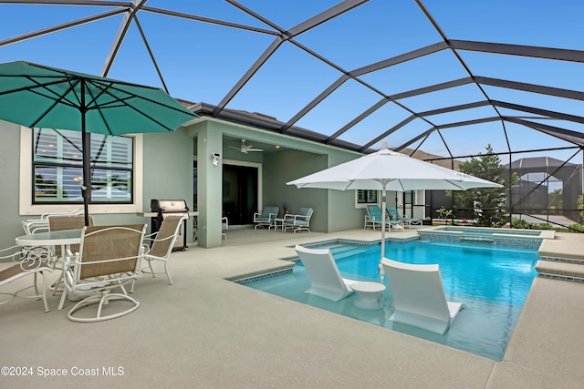 view of pool featuring ceiling fan, a lanai, a patio area, an in ground hot tub, and area for grilling