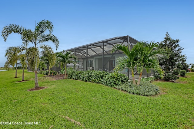 view of yard with glass enclosure