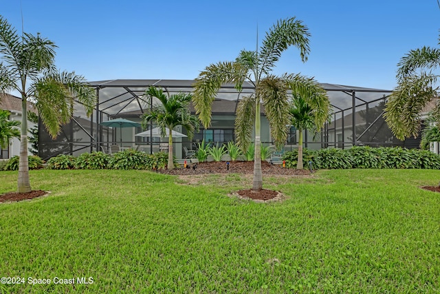 view of yard featuring glass enclosure