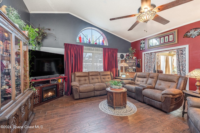 living room with vaulted ceiling, crown molding, ceiling fan, and dark hardwood / wood-style floors