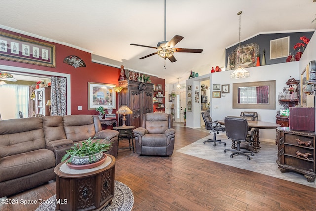 living room featuring hardwood / wood-style floors, vaulted ceiling, ceiling fan, and crown molding