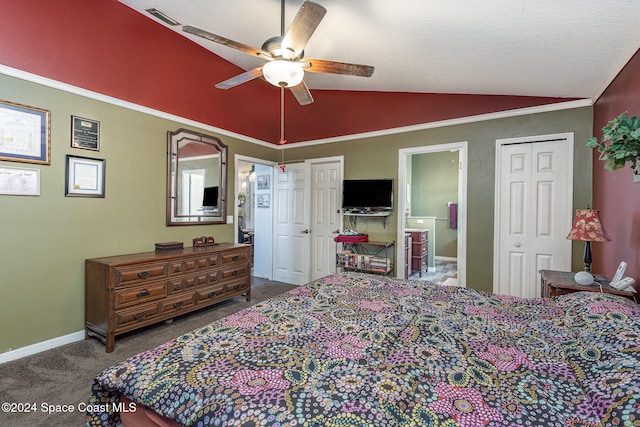 carpeted bedroom with ceiling fan, lofted ceiling, and a textured ceiling