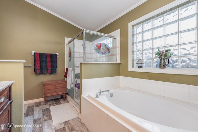 bathroom with hardwood / wood-style floors, vanity, independent shower and bath, and ornamental molding