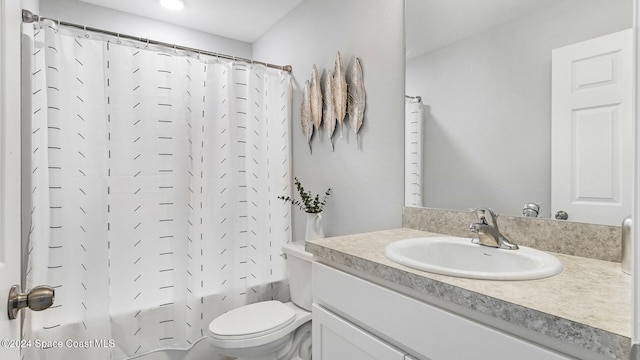 full bathroom with shower / tub combo, vanity, and toilet