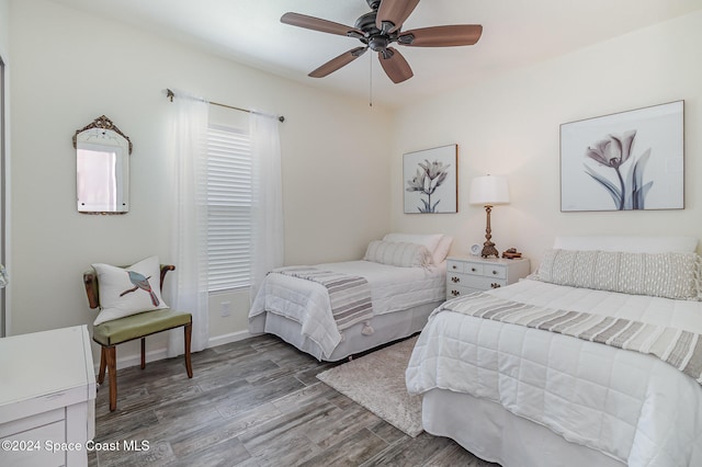 bedroom featuring ceiling fan and hardwood / wood-style flooring