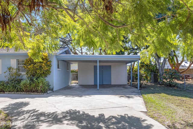 garage featuring a carport