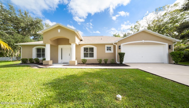 view of front of property with a garage and a front lawn