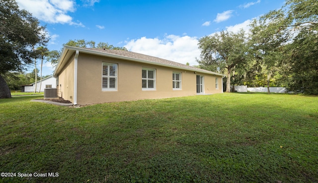 back of house with a yard