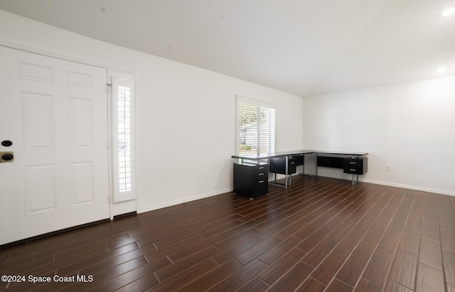 unfurnished office with dark hardwood / wood-style flooring