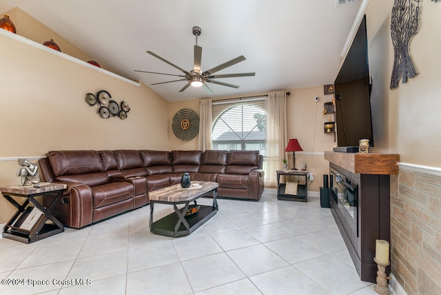 living room featuring ceiling fan, light tile patterned flooring, and vaulted ceiling