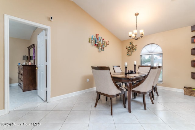 tiled dining area featuring a notable chandelier and lofted ceiling