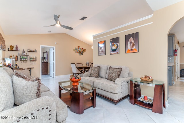 living room with vaulted ceiling, ceiling fan, and light tile patterned flooring