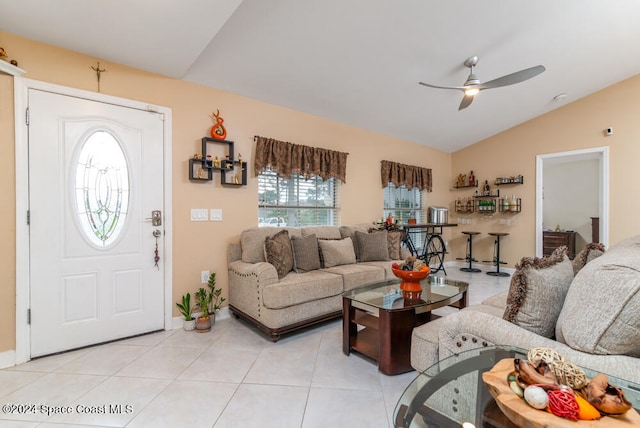 tiled living room with vaulted ceiling and ceiling fan