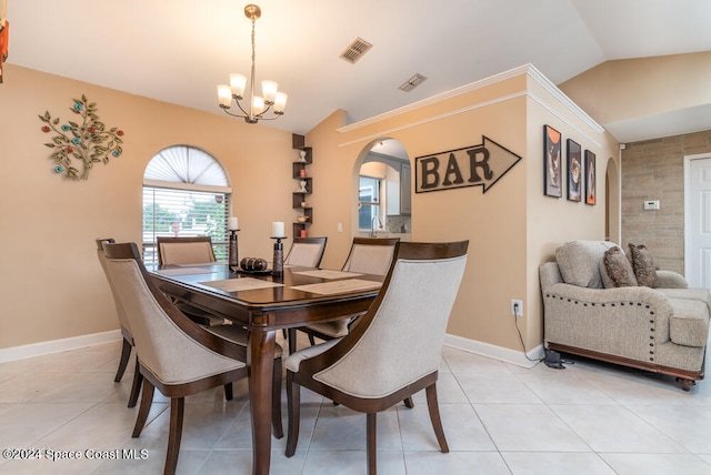 dining area with light tile patterned floors, lofted ceiling, and a notable chandelier