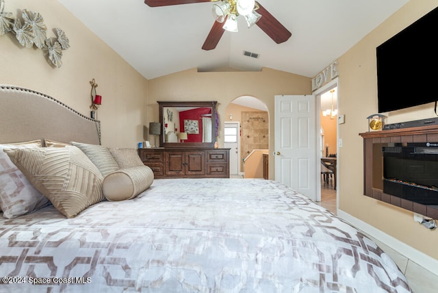 bedroom with tile patterned floors, ceiling fan, and vaulted ceiling