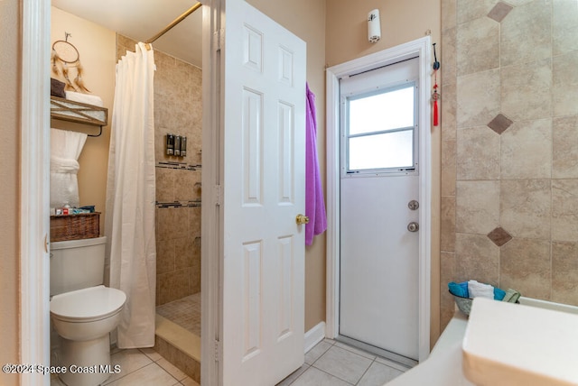 bathroom featuring tile patterned floors, toilet, and a shower with shower curtain