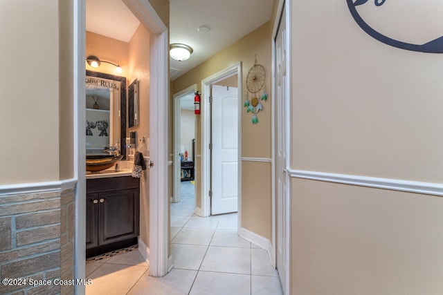 bathroom with tile patterned floors and vanity