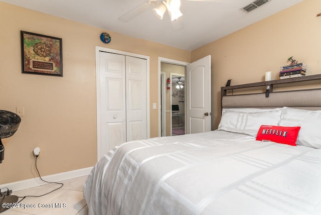 tiled bedroom with a closet and ceiling fan