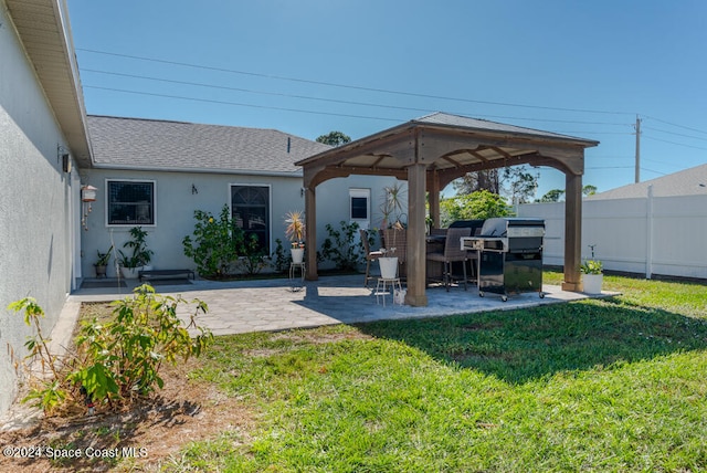 view of yard featuring a gazebo and a patio area