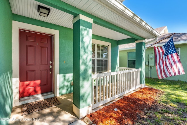 doorway to property with a porch