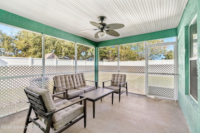 sunroom / solarium featuring ceiling fan and plenty of natural light